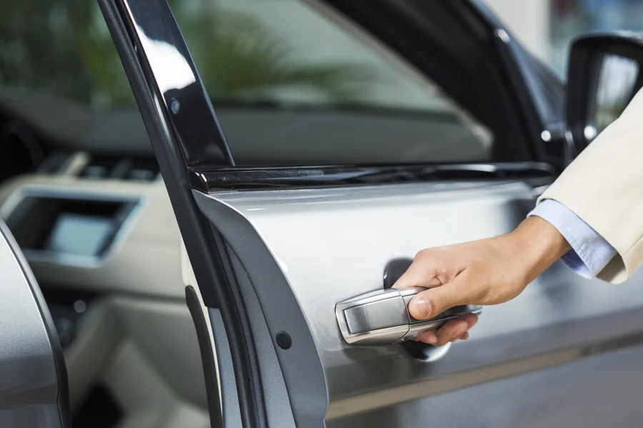 A hand opening a passenger car door, from the existing RIDE VMS website